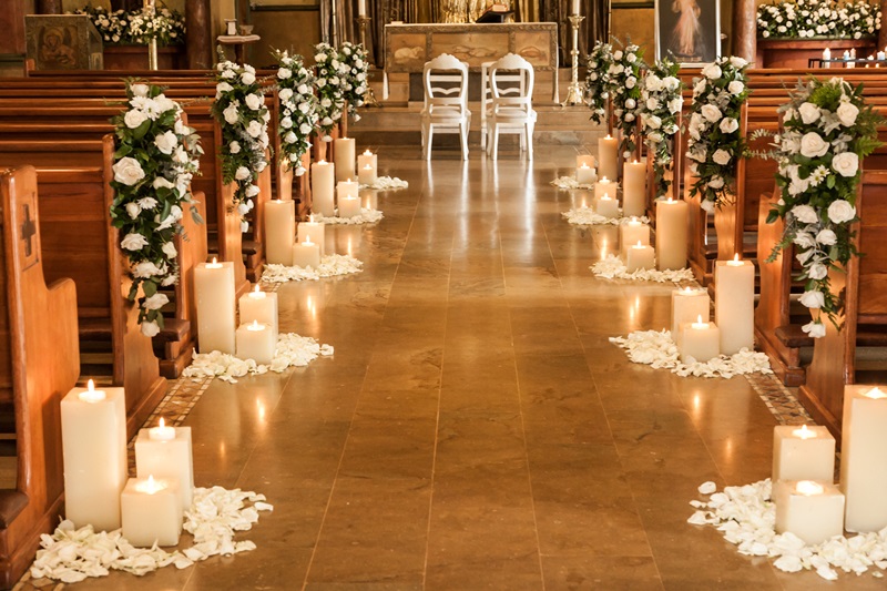 Catholic temple decorated with flowers and candles for wedding