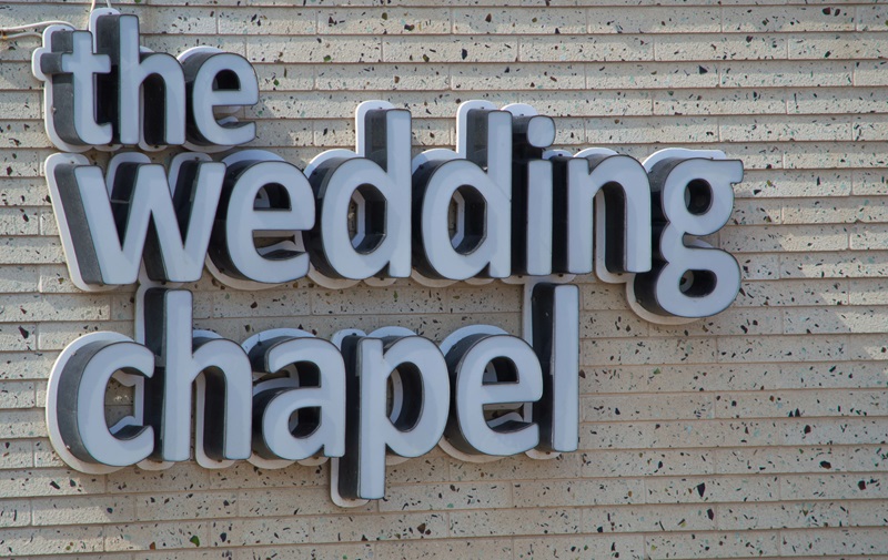 The wedding chapel sign on cement wall